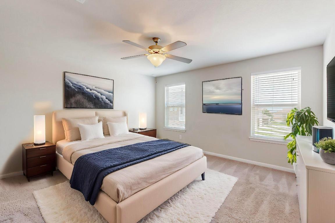 2908 Harvester Lane Round Rock, TX 78664 - Photo 39 of 40 a bedroom with a bed and a chandelier