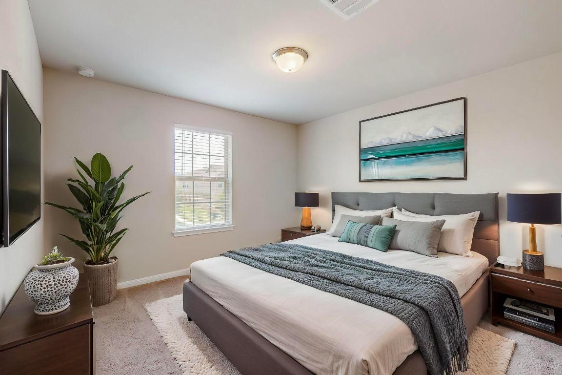 2908 Harvester Lane Round Rock, TX 78664 - Photo 40 of 40 a bedroom with bed and a potted plant