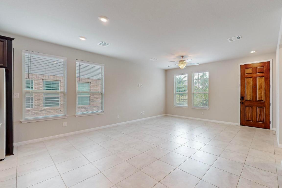 2908 Harvester Lane Round Rock, TX 78664 - Photo 6 of 40 a view of an empty room with a window