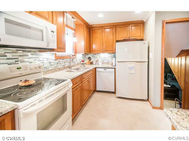 6433 Commander Road Richmond, VA 23224 - Photo 18 of 21 a kitchen with a sink stove and refrigerator