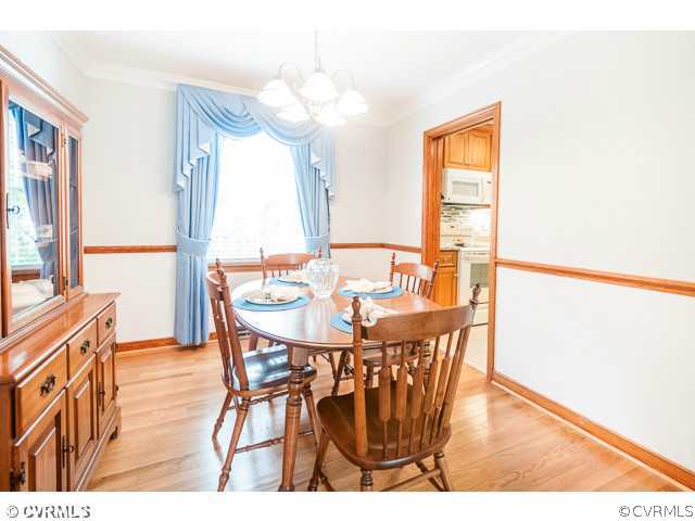 6433 Commander Road Richmond, VA 23224 - Photo 21 of 21 a view of a dining room with furniture and wooden floor