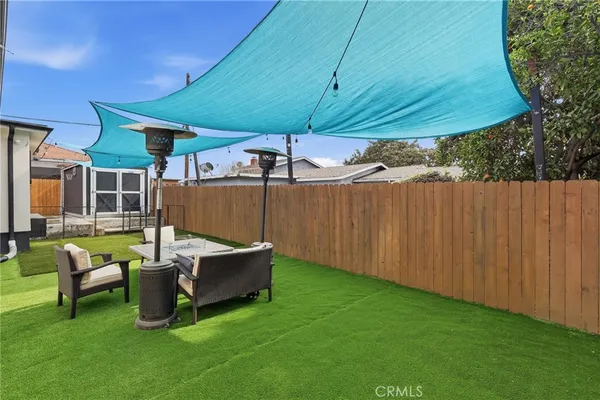 a view of a backyard with a small cabin