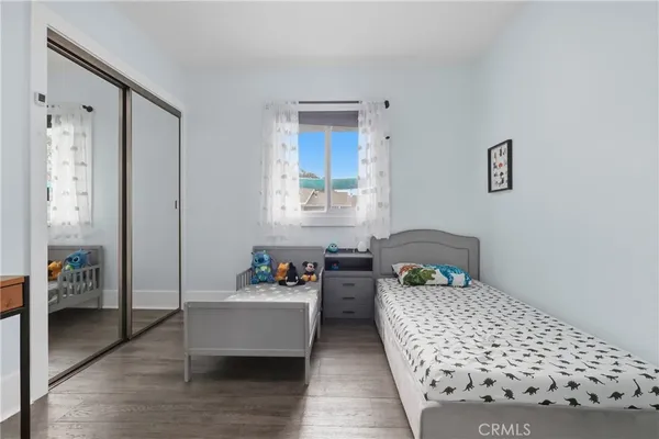 a bedroom with bed and window