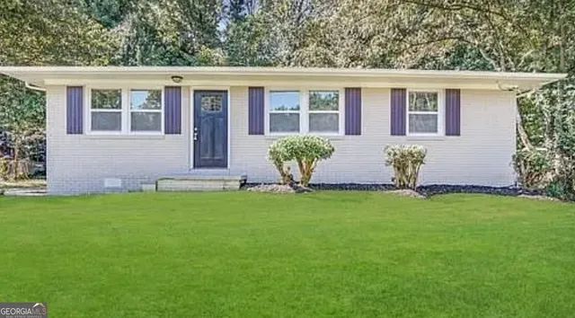 front view of a house with a yard