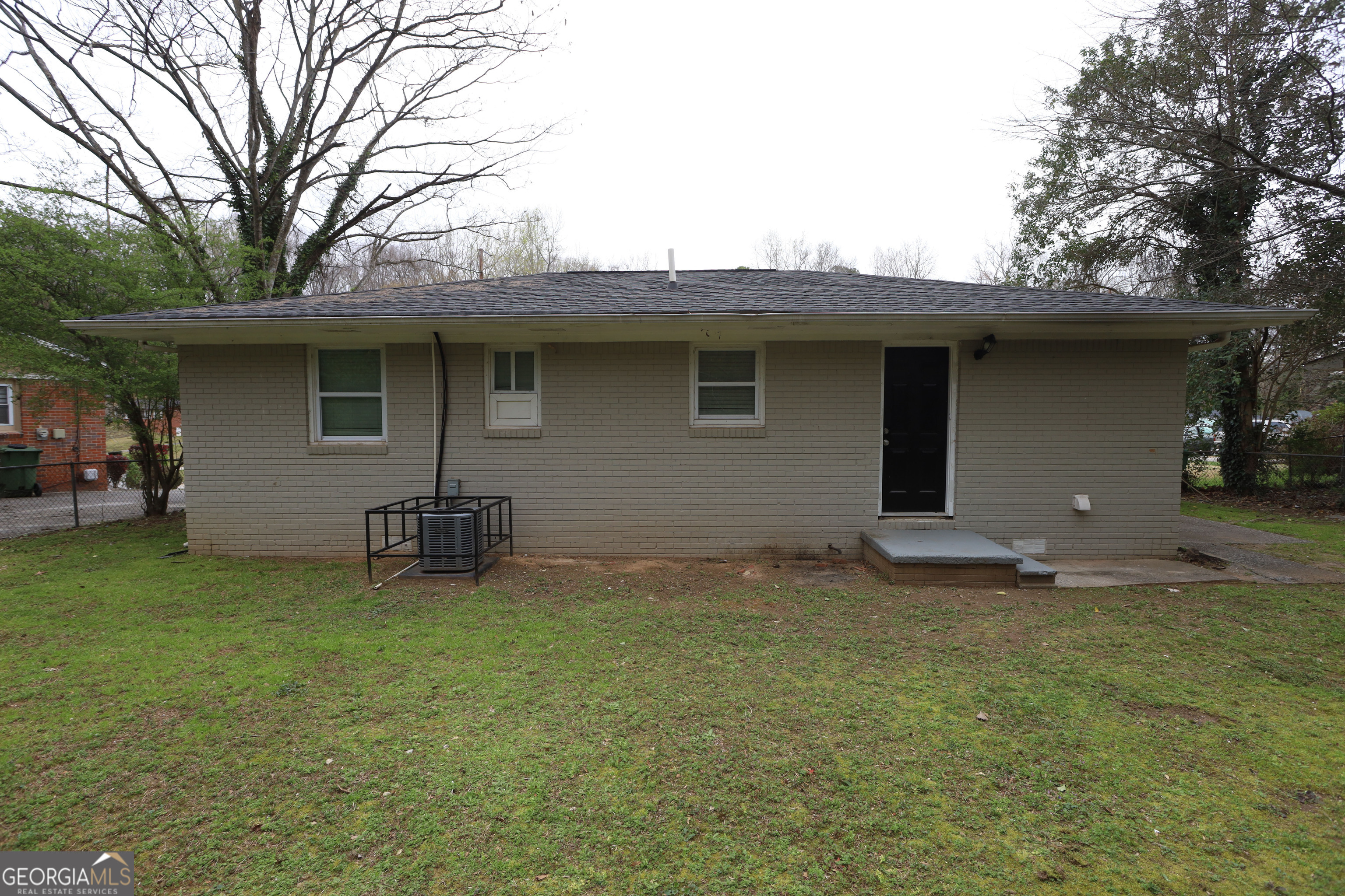 3410 Adkins Road Northwest Atlanta, GA 30331 - Photo 11 of 11 a backyard of a house with table and chairs