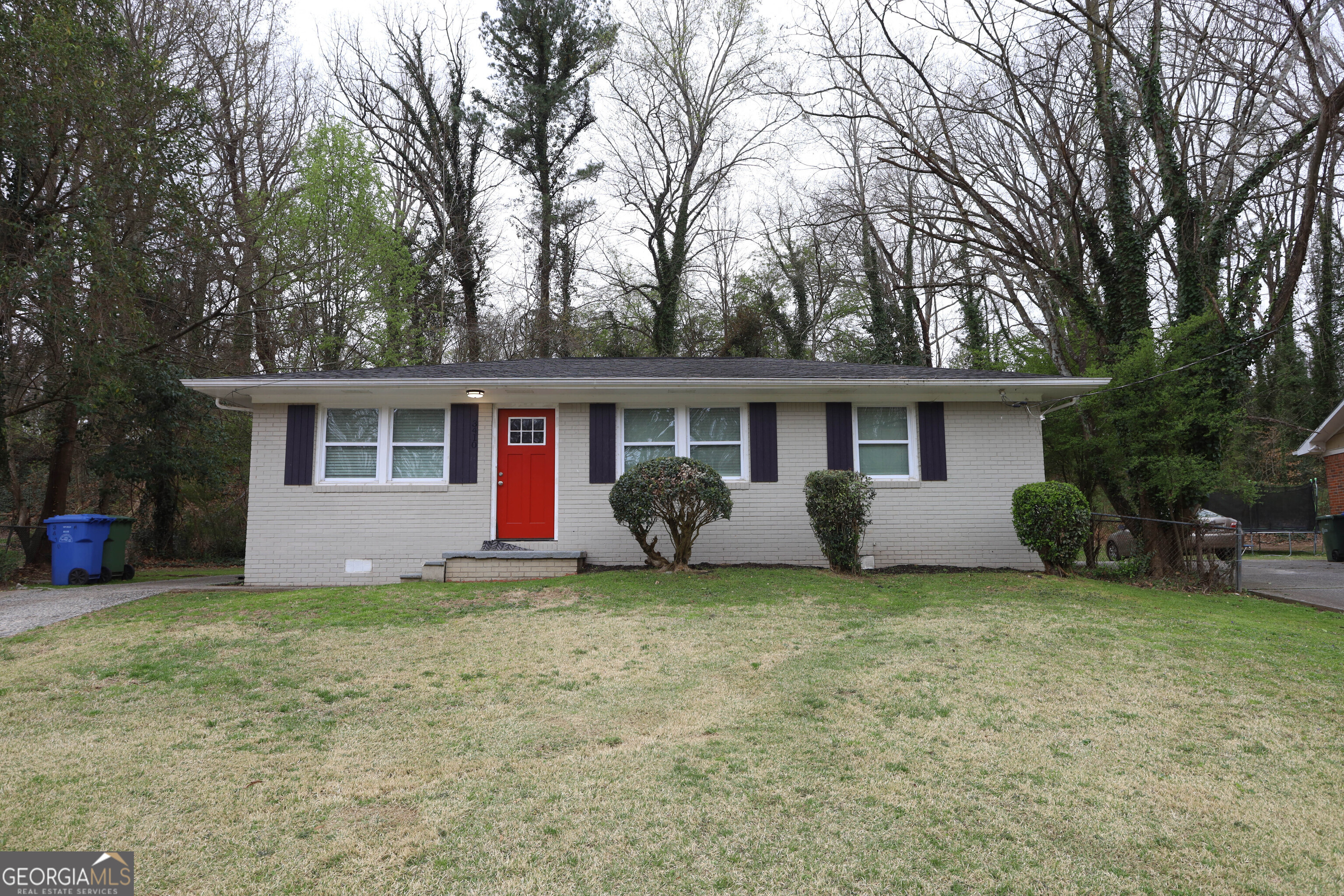 3410 Adkins Road Northwest Atlanta, GA 30331 - Photo 2 of 11 a view of a house with a yard and large tree