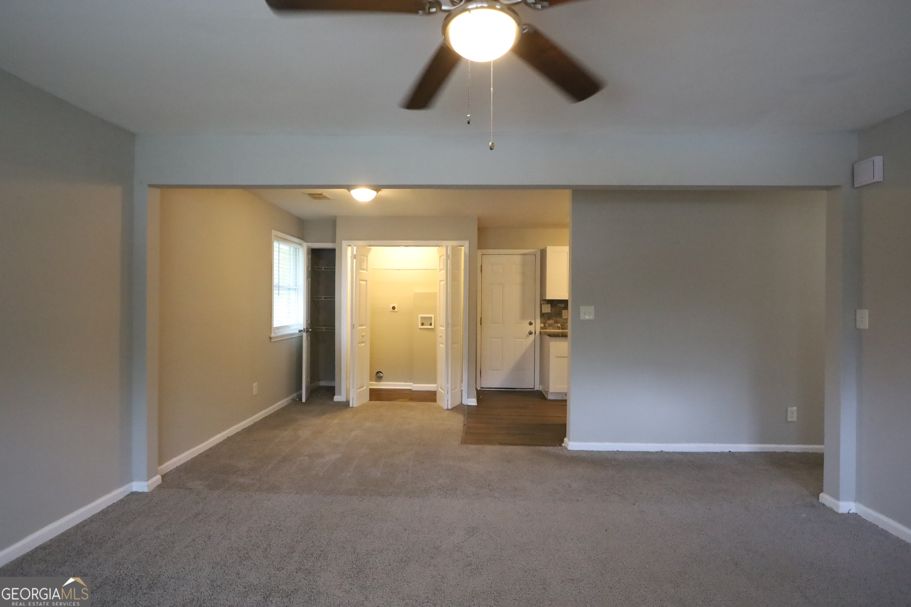 3410 Adkins Road Northwest Atlanta, GA 30331 - Photo 4 of 11 an empty room with chandelier fan