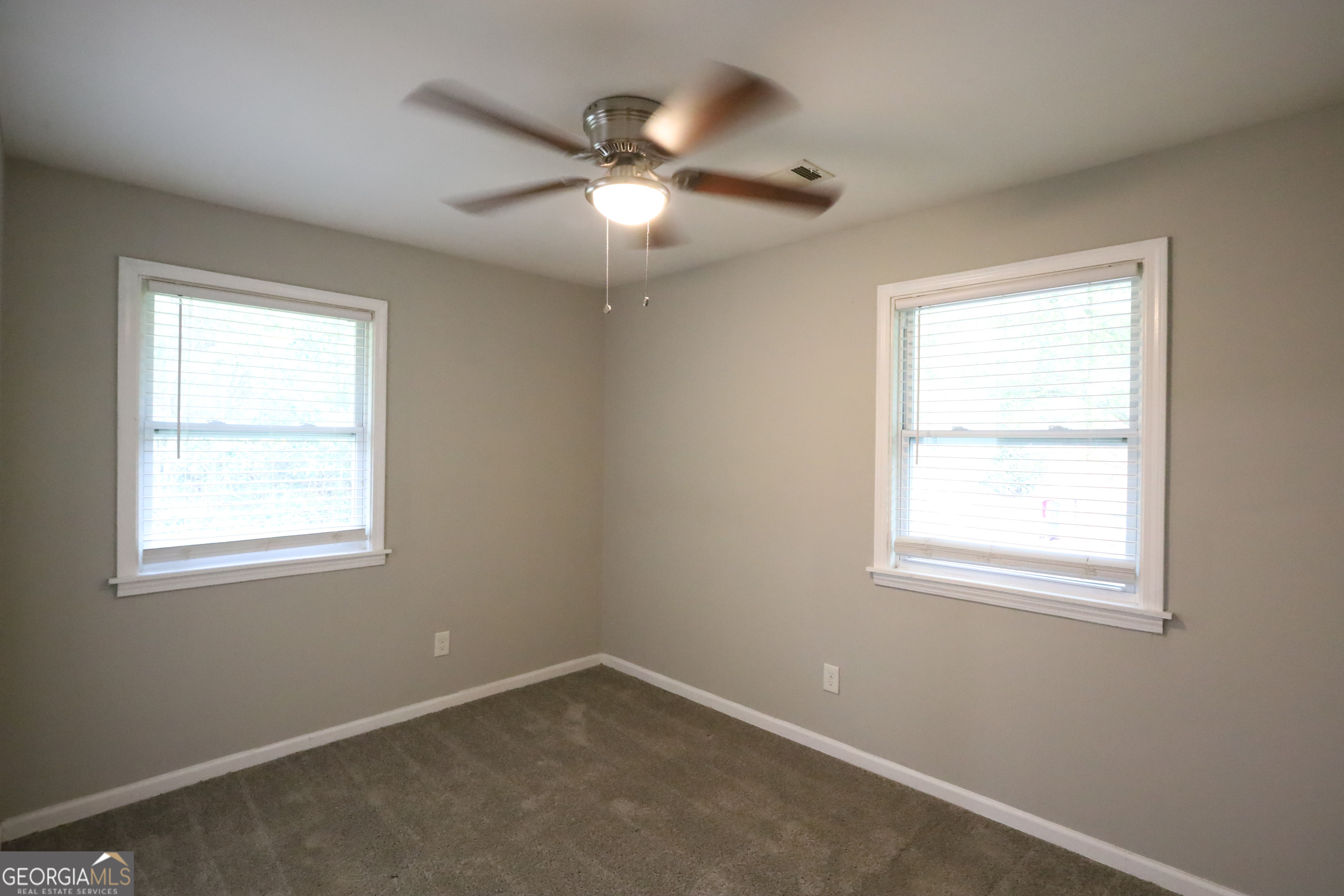3410 Adkins Road Northwest Atlanta, GA 30331 - Photo 10 of 11 an empty room with a window and a fan