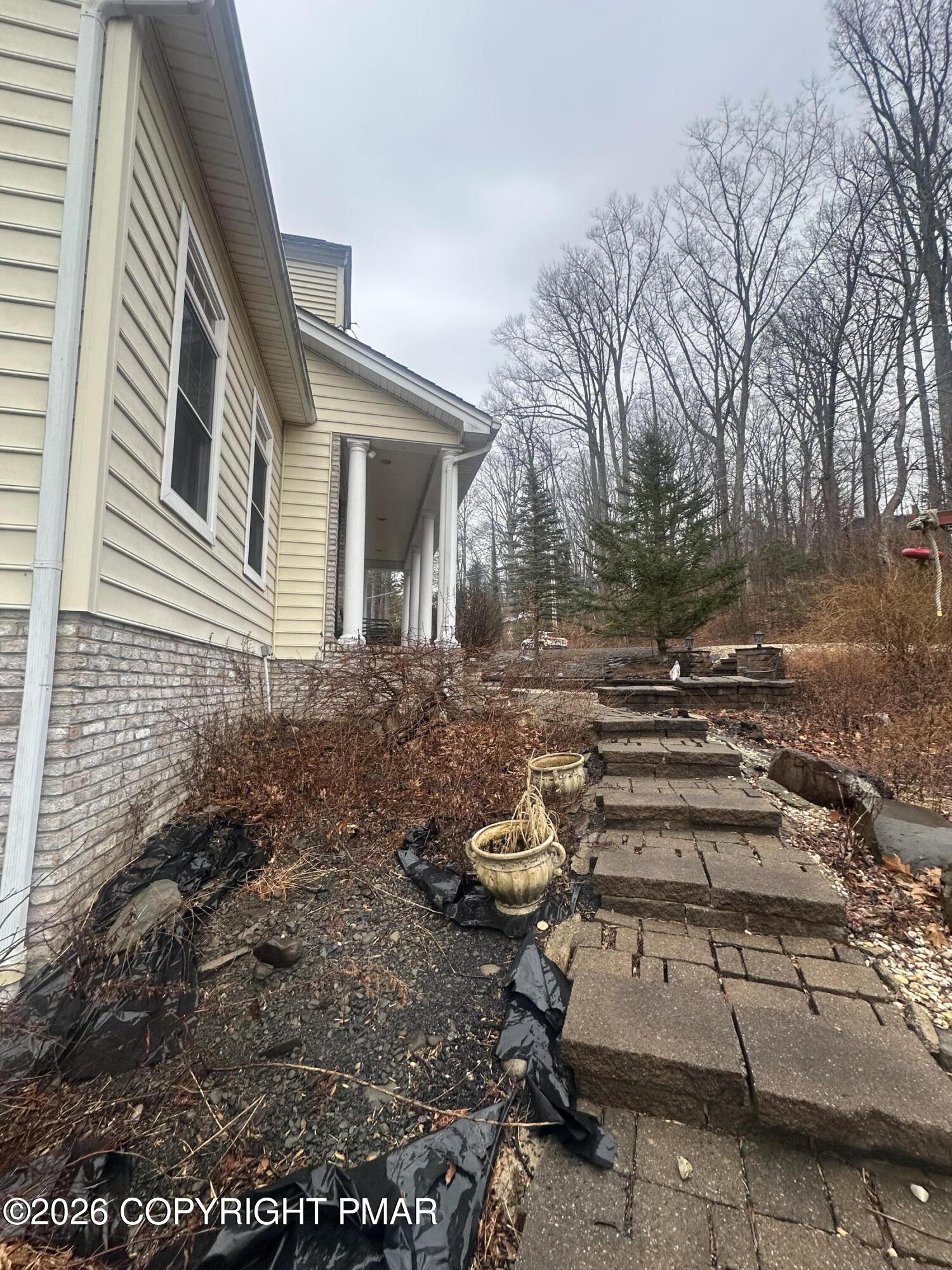 2 Shepard Court Delaware Water Gap, PA 18327 - Photo 16 of 57 a front view of a house with lots of green space