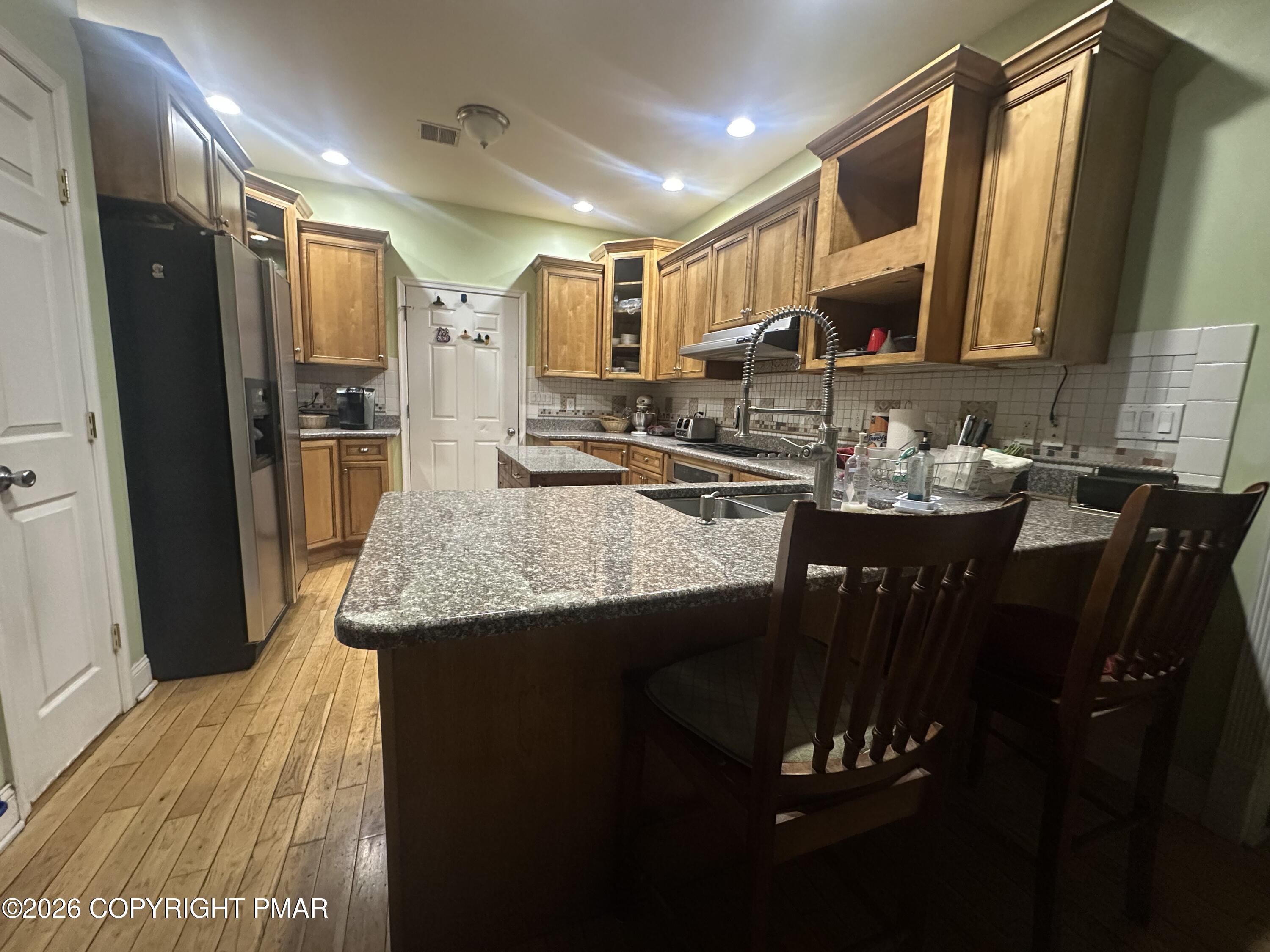 2 Shepard Court Delaware Water Gap, PA 18327 - Photo 22 of 57 a kitchen with a sink refrigerator and cabinets