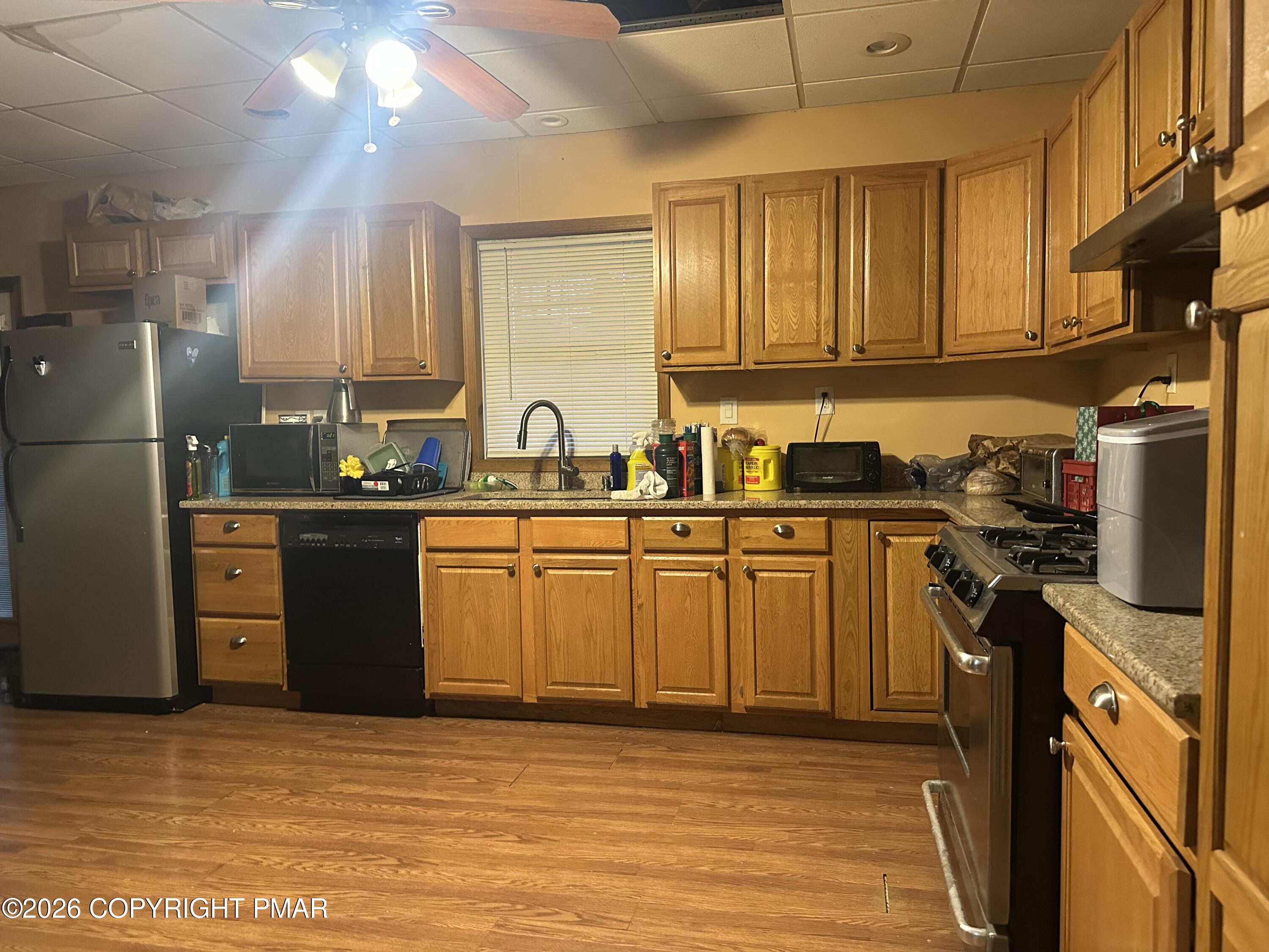 2 Shepard Court Delaware Water Gap, PA 18327 - Photo 48 of 57 a kitchen with stainless steel appliances granite countertop a sink stove and refrigerator