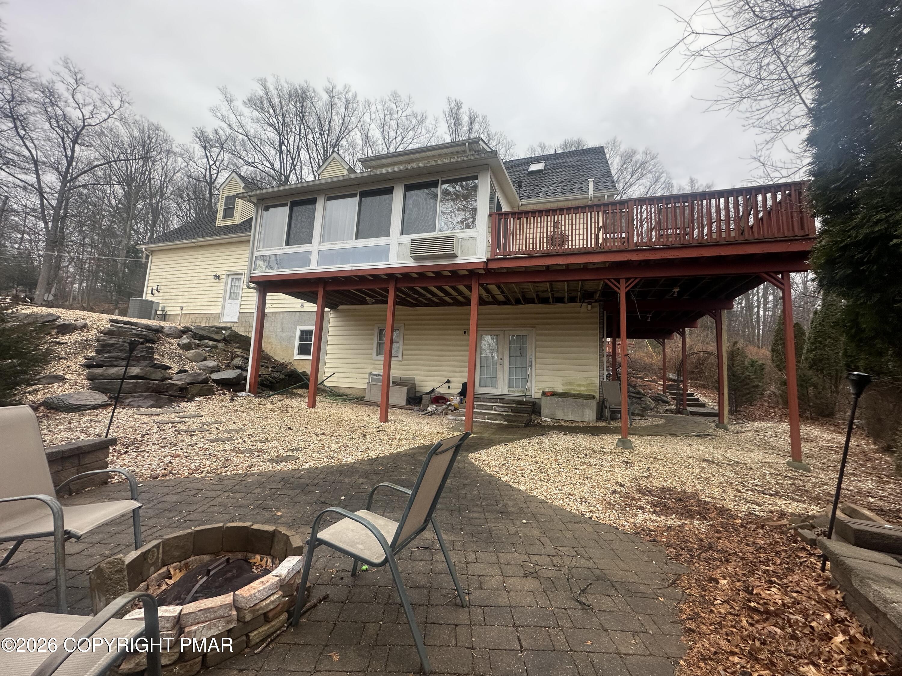 2 Shepard Court Delaware Water Gap, PA 18327 - Photo 10 of 57 a view of a dinning table and chairs in patio