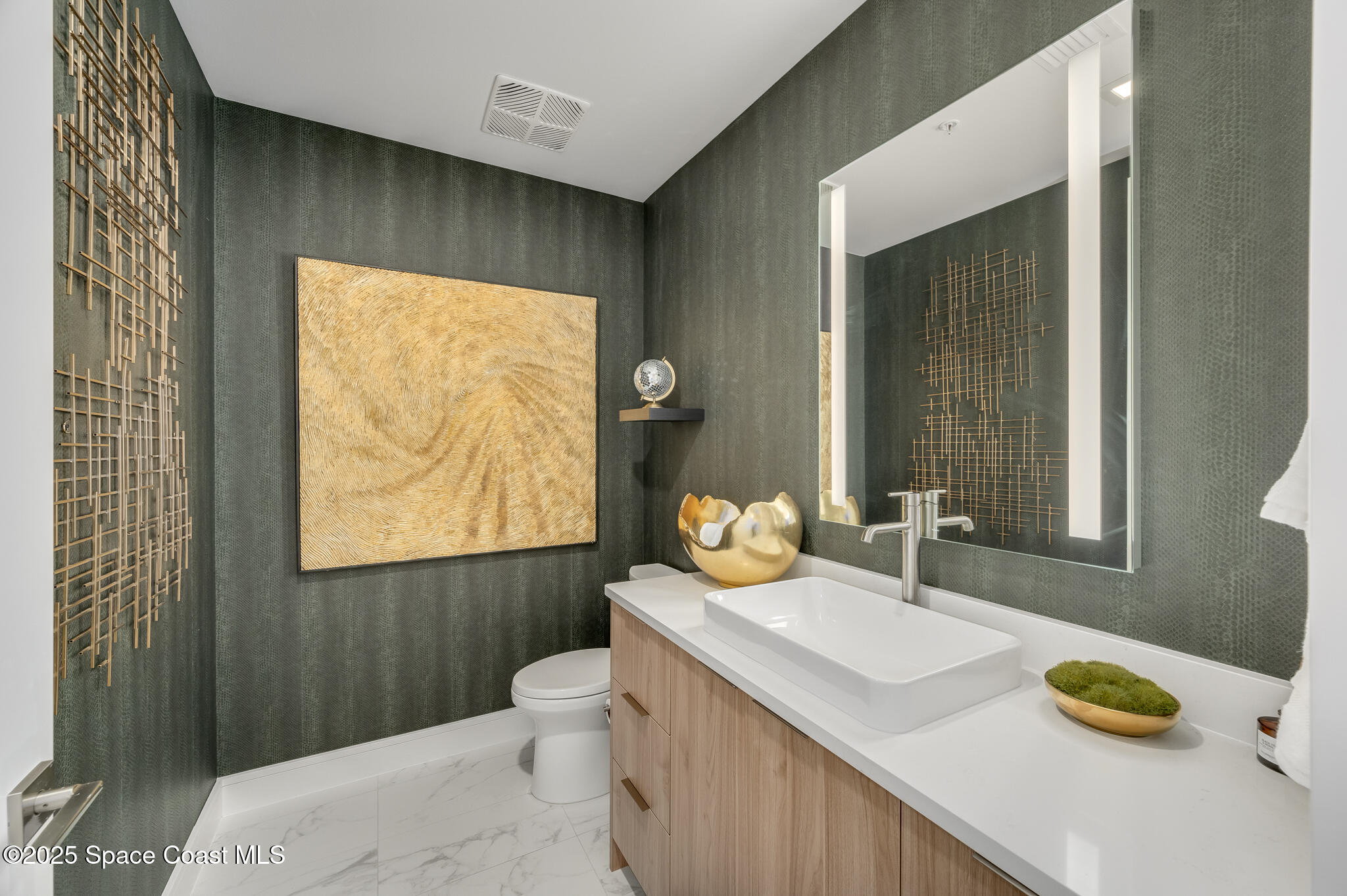 65 North Atlantic Avenue, Unit 404 Cocoa Beach, FL 32931 - Photo 14 of 57 Main guest half bathroom