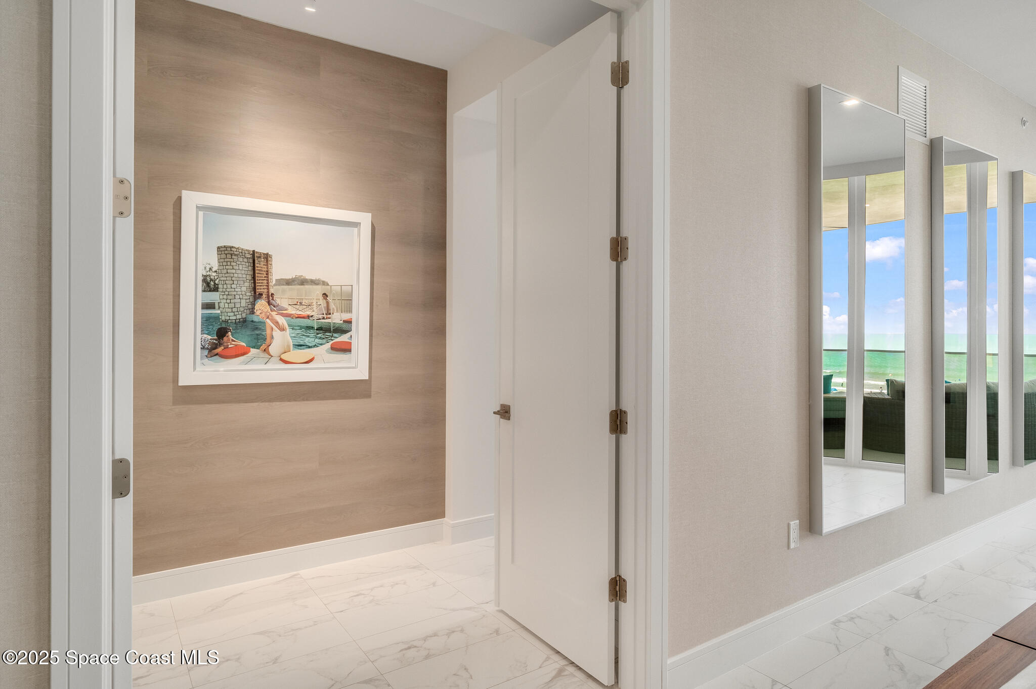 65 North Atlantic Avenue, Unit 404 Cocoa Beach, FL 32931 - Photo 40 of 57 Doorway to owner suite