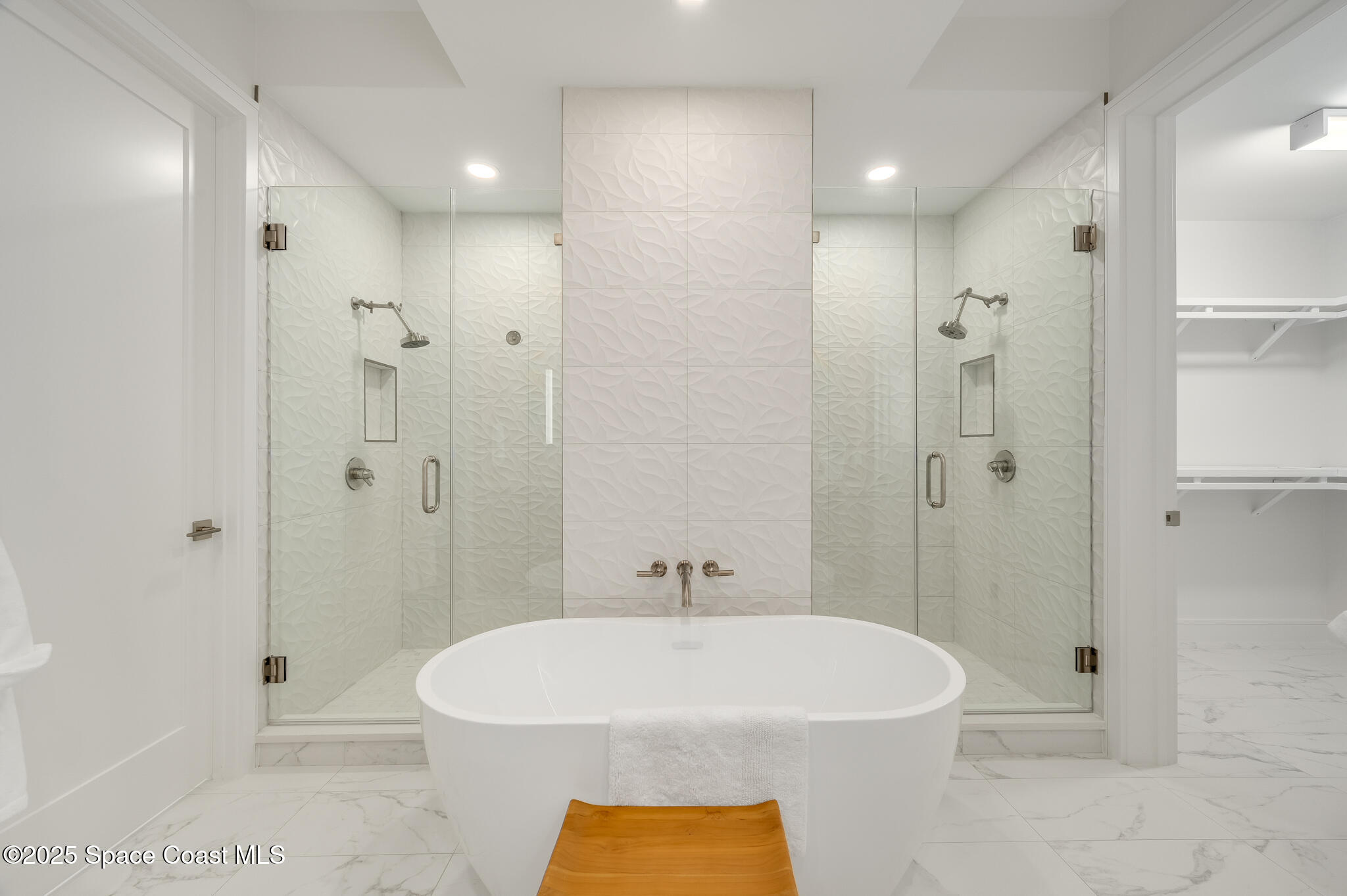 65 North Atlantic Avenue, Unit 404 Cocoa Beach, FL 32931 - Photo 42 of 57 Owners suite shower area and soak tub