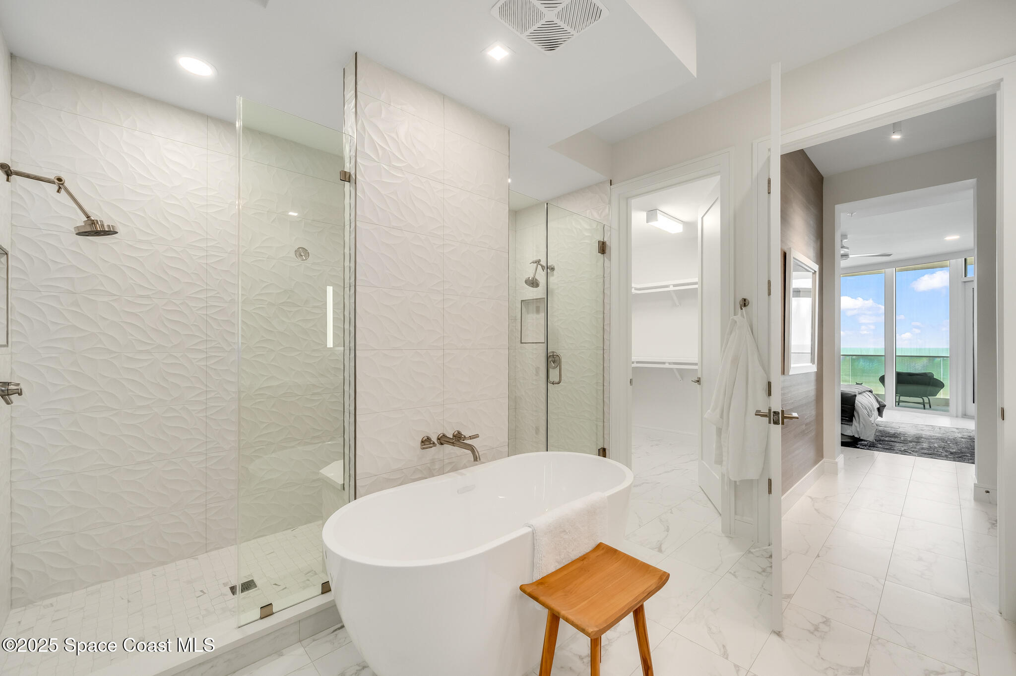 65 North Atlantic Avenue, Unit 404 Cocoa Beach, FL 32931 - Photo 43 of 57 Owner suite shower tub