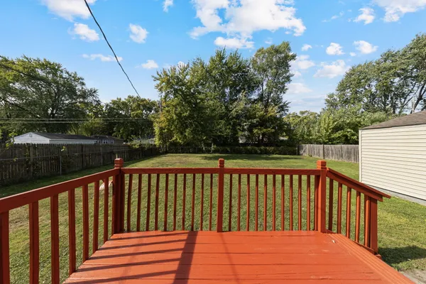 a balcony with trees in front of it