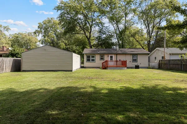 a front view of house with an outdoor space and seating