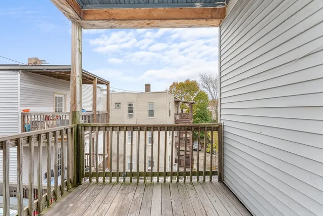 a view of a balcony with wooden floor