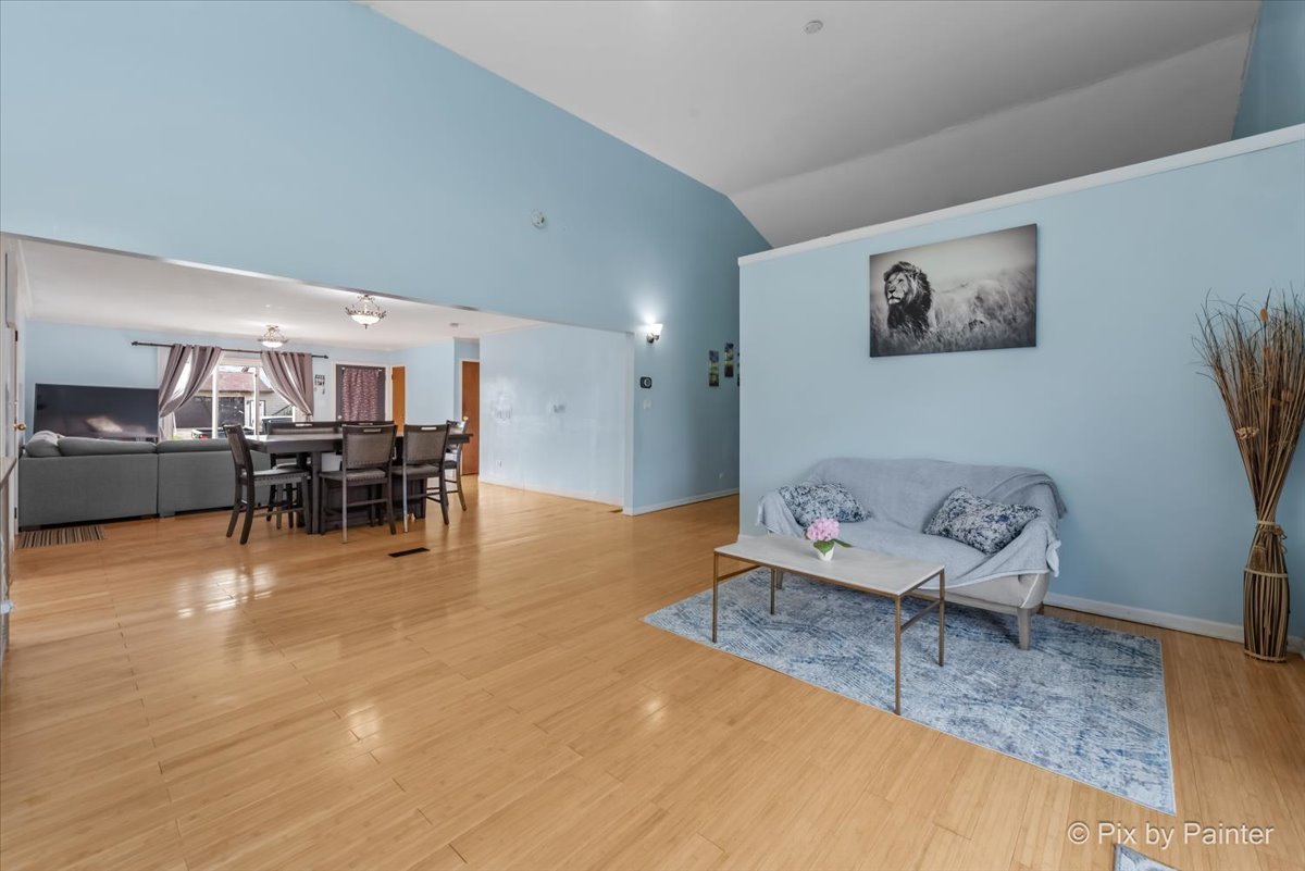 27 South Oltendorf Road Streamwood, IL 60107 - Photo 13 of 31 a living room with furniture and a table with wooden floor