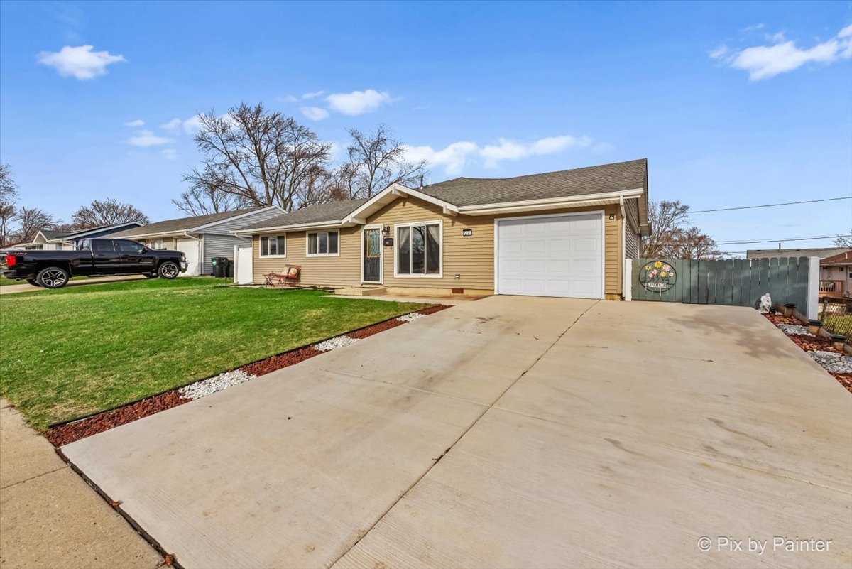 27 South Oltendorf Road Streamwood, IL 60107 - Photo 22 of 31 a view of a house with a yard and potted plants