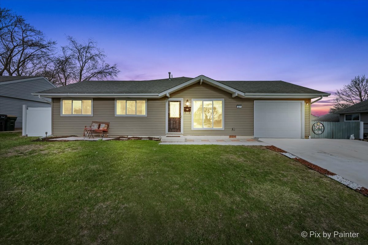 27 South Oltendorf Road Streamwood, IL 60107 - Photo 23 of 31 a front view of a house with a garden and yard