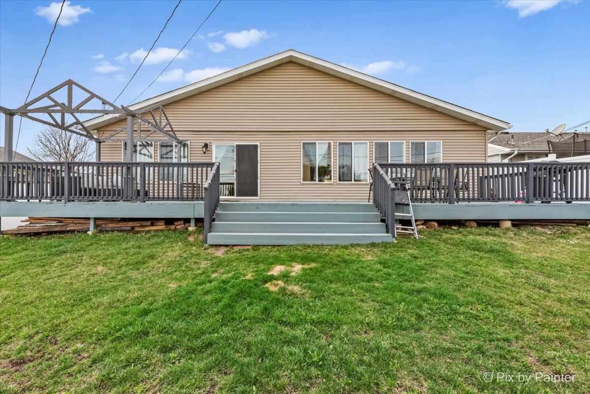 27 South Oltendorf Road Streamwood, IL 60107 - Photo 26 of 31 a view of a house with a yard and deck