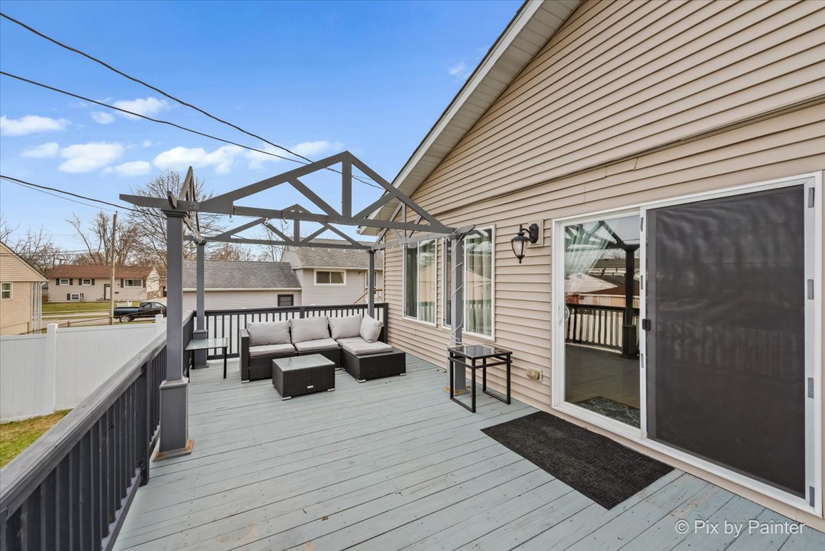 27 South Oltendorf Road Streamwood, IL 60107 - Photo 29 of 31 a view of a balcony with couch and wooden floor