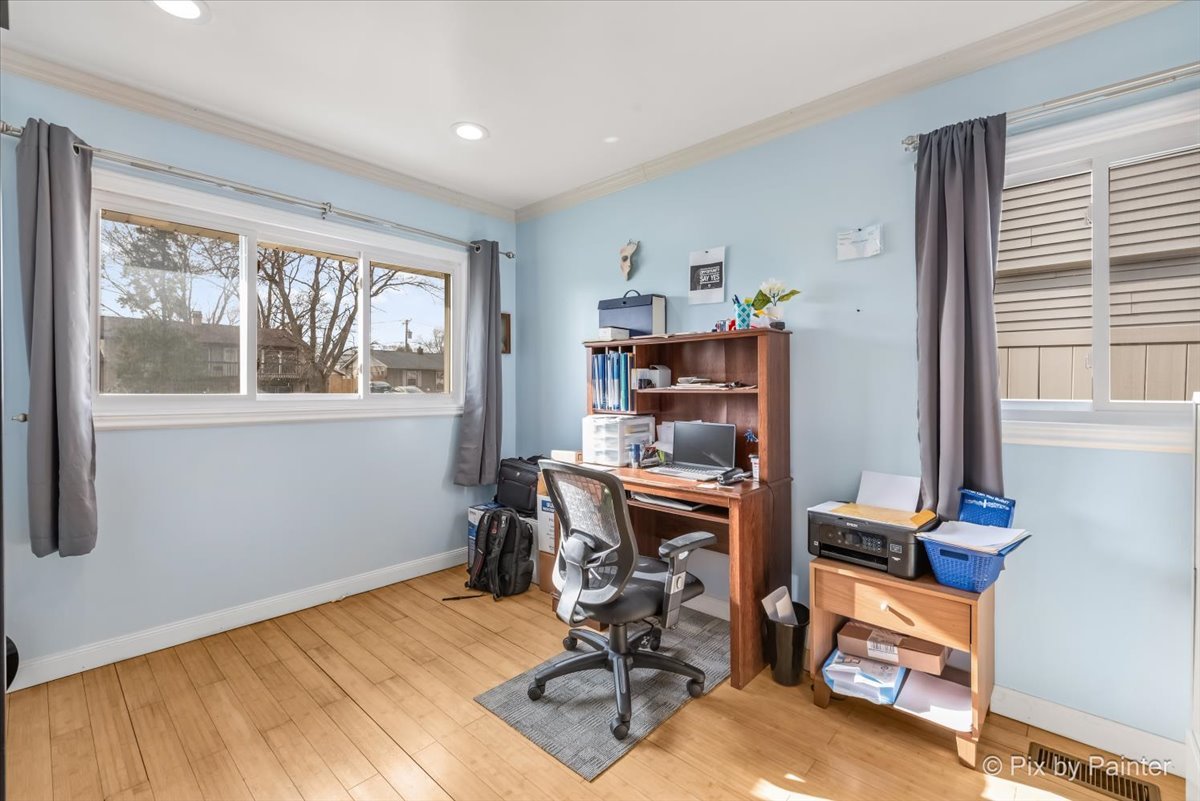 27 South Oltendorf Road Streamwood, IL 60107 - Photo 3 of 31 a view of a workspace with furniture and a window