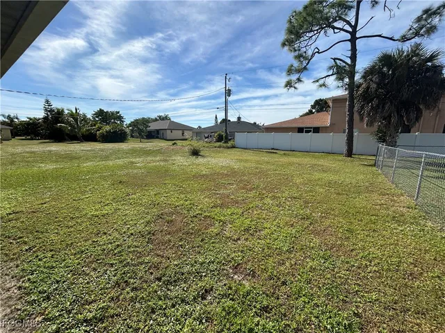 a front view of the house with a garden