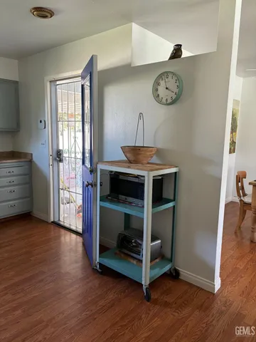 a view of room with window and wooden floor