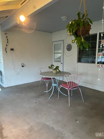 a dining room with a table and chairs