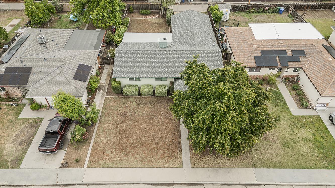 1350 Mill Street Selma, CA 93662 - Photo 4 of 47 an aerial view of a house with garden space and sitting area