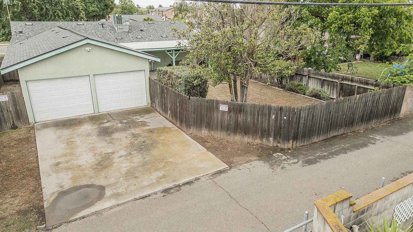 1350 Mill Street Selma, CA 93662 - Photo 42 of 47 a view of a small house with wooden fence