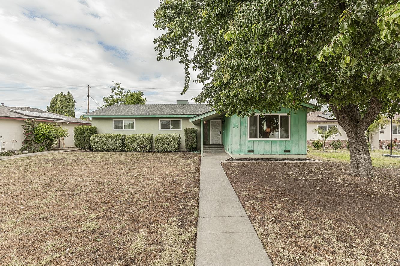 1350 Mill Street Selma, CA 93662 - Photo 47 of 47 a front view of a house with a garden