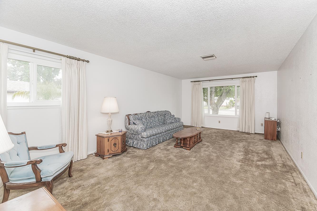 1350 Mill Street Selma, CA 93662 - Photo 6 of 47 a living room with furniture and a window