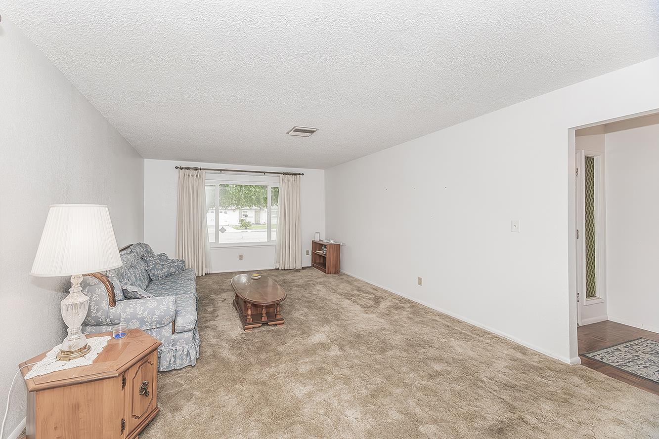 1350 Mill Street Selma, CA 93662 - Photo 7 of 47 a living room with furniture and a window