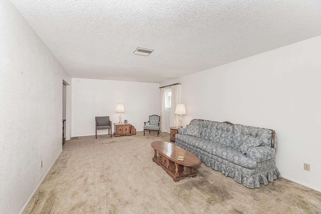 1350 Mill Street Selma, CA 93662 - Photo 8 of 47 a living room with furniture and a couch