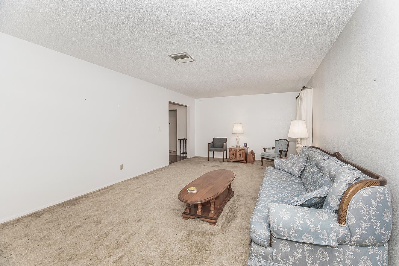 1350 Mill Street Selma, CA 93662 - Photo 9 of 47 a living room with furniture and white walls