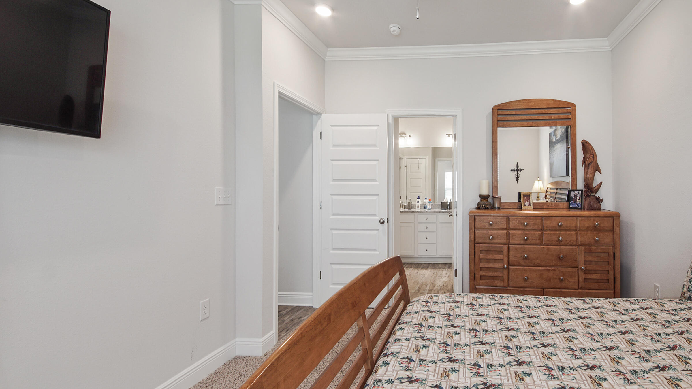 158 Lightning Bug Lane Freeport, FL 32439 - Photo 16 of 23 a room with a dresser and a mirror