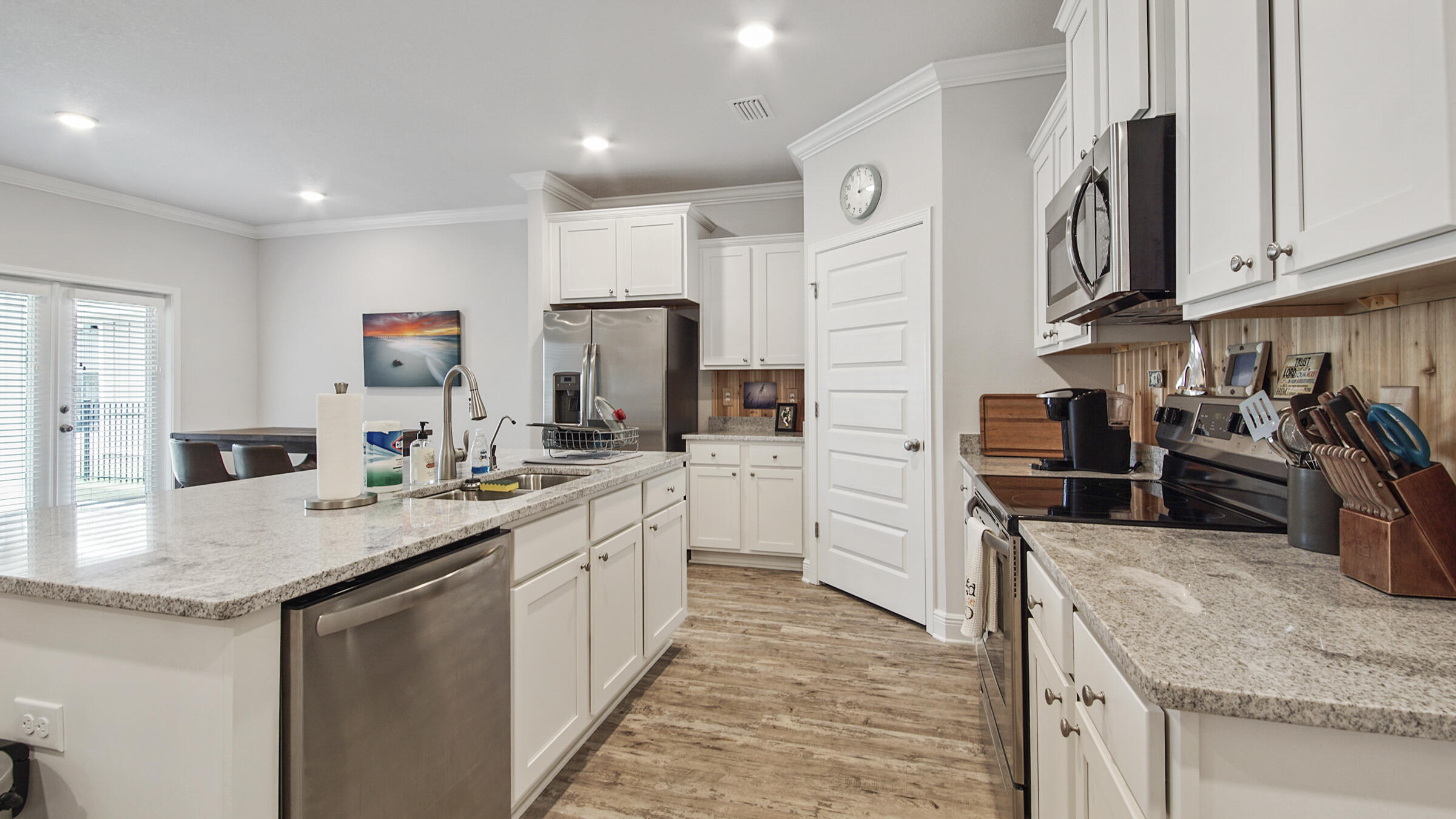 158 Lightning Bug Lane Freeport, FL 32439 - Photo 8 of 23 a kitchen with stainless steel appliances granite countertop a sink stove and refrigerator