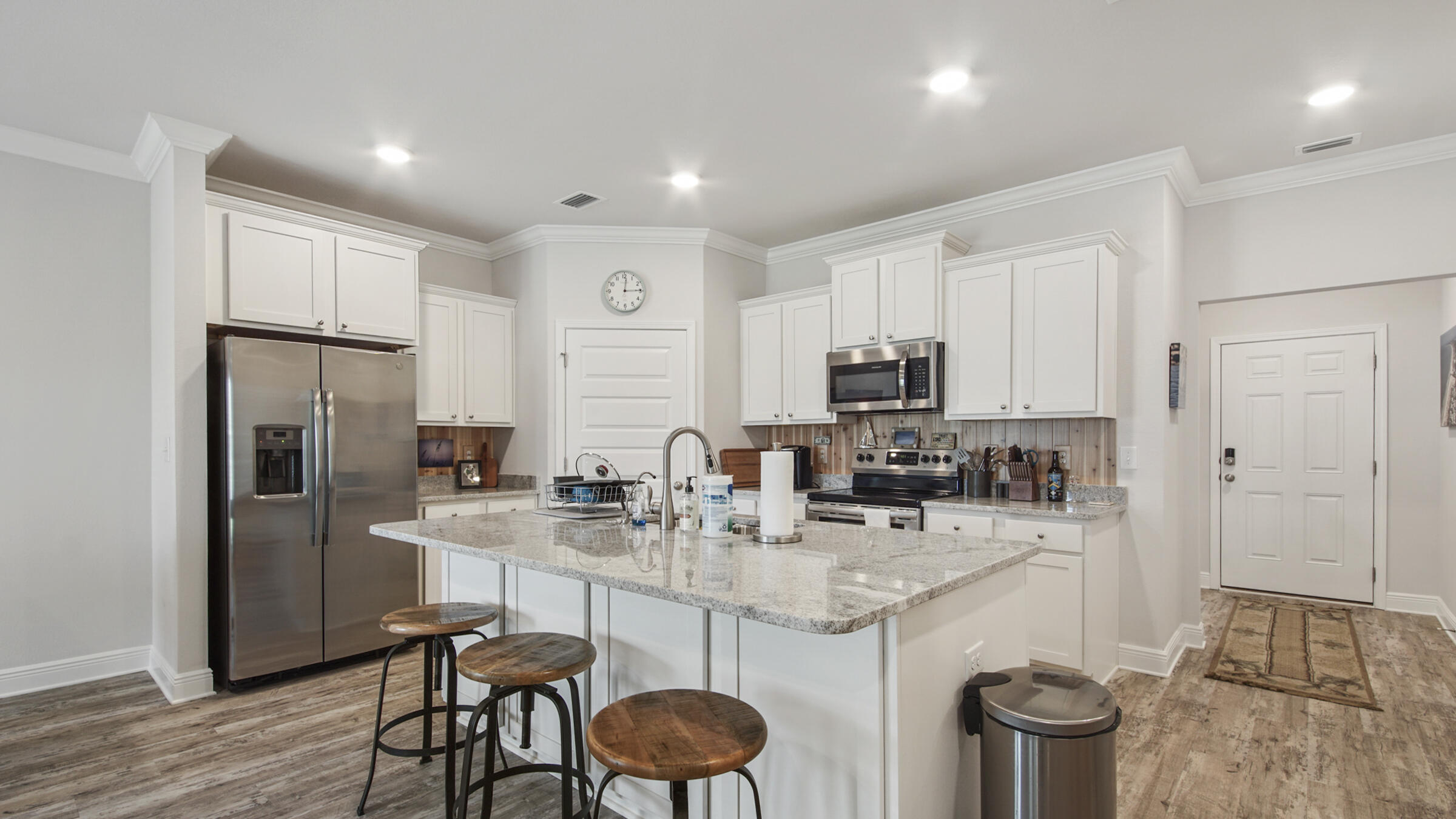 158 Lightning Bug Lane Freeport, FL 32439 - Photo 10 of 23 a kitchen with stainless steel appliances granite countertop a sink stove and refrigerator