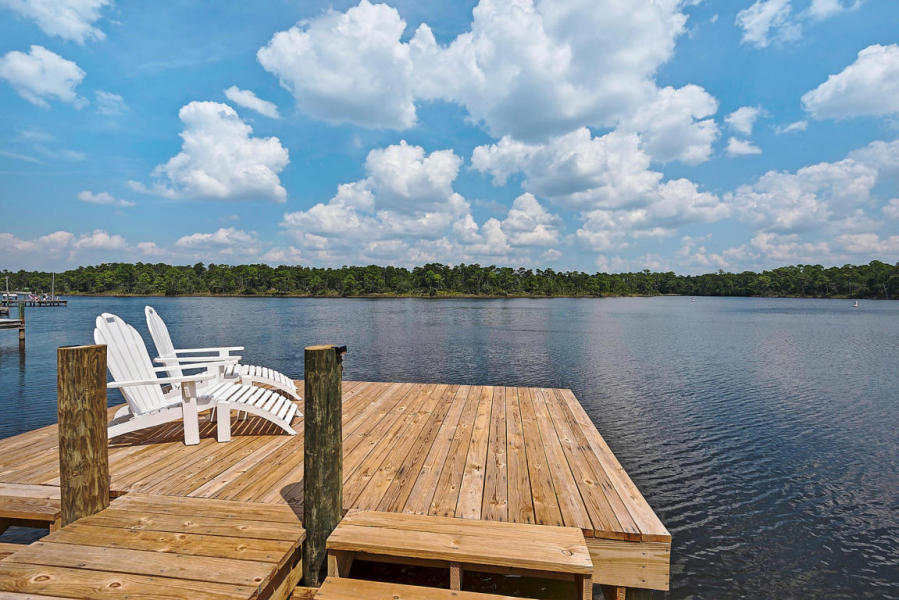 a view of a lake with furniture