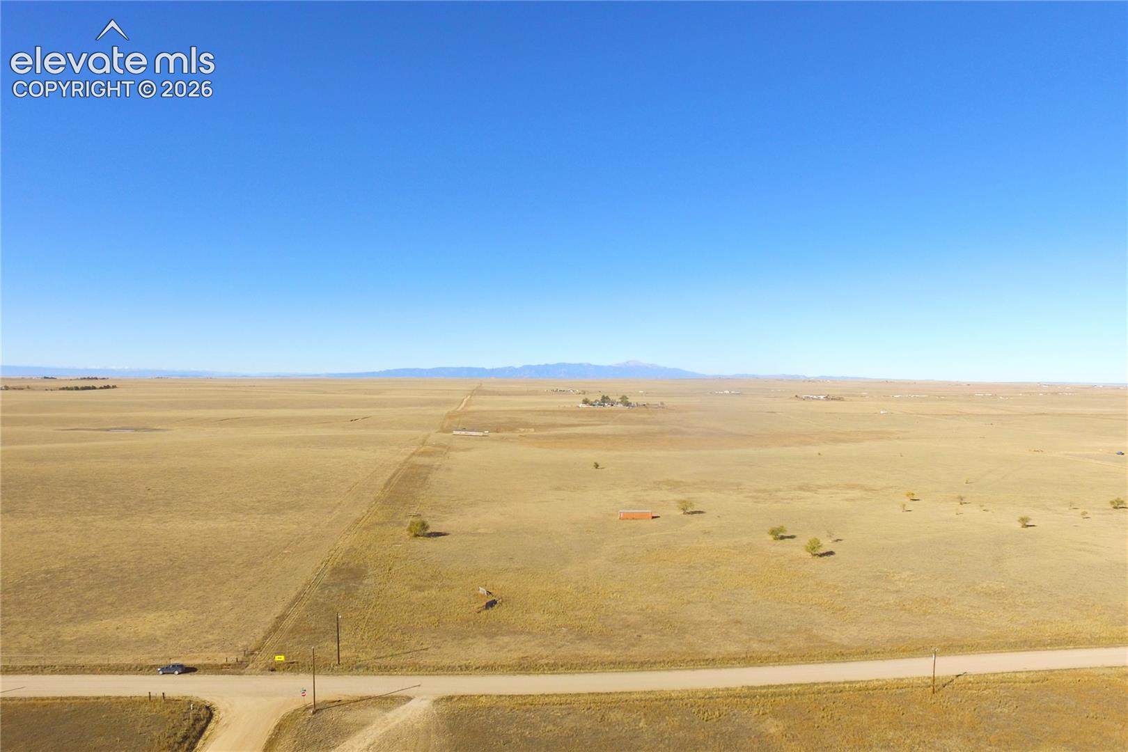 View of rural area featuring a desert landscape and mountains