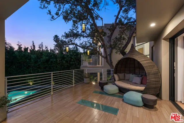a wooden bench sitting in front of a building