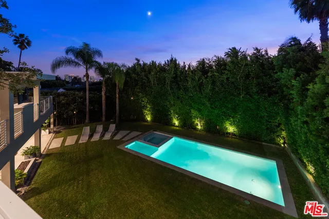 an aerial view of a house with a garden