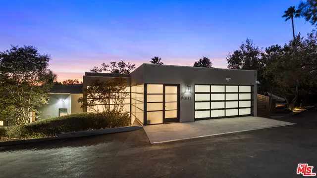 a view of spacious bedroom with a large window and a yard