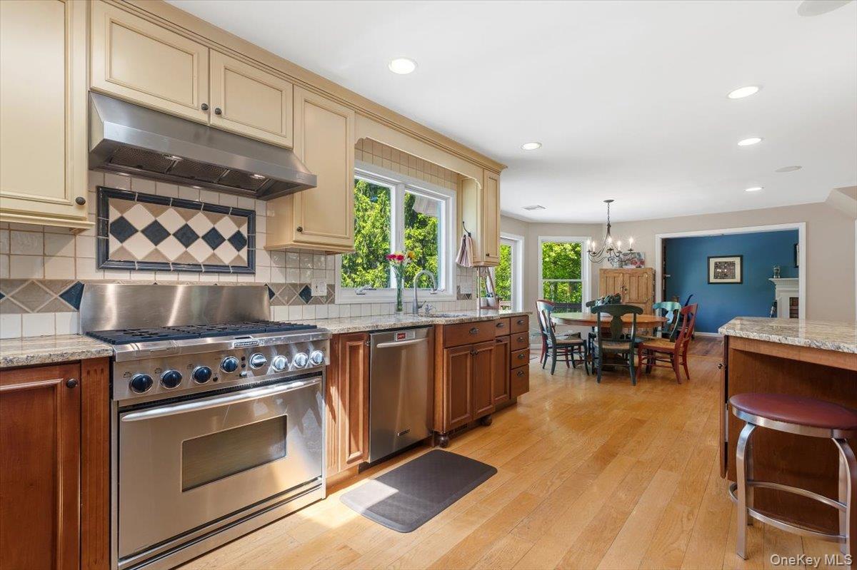 119 Edgewood Road Ossining, NY 10562 - Photo 8 of 50 From this view of the beautiful Kitchen you can see and appreciate the 6 burner propane gas Oven/Range, the artistic tiles and additional seating.