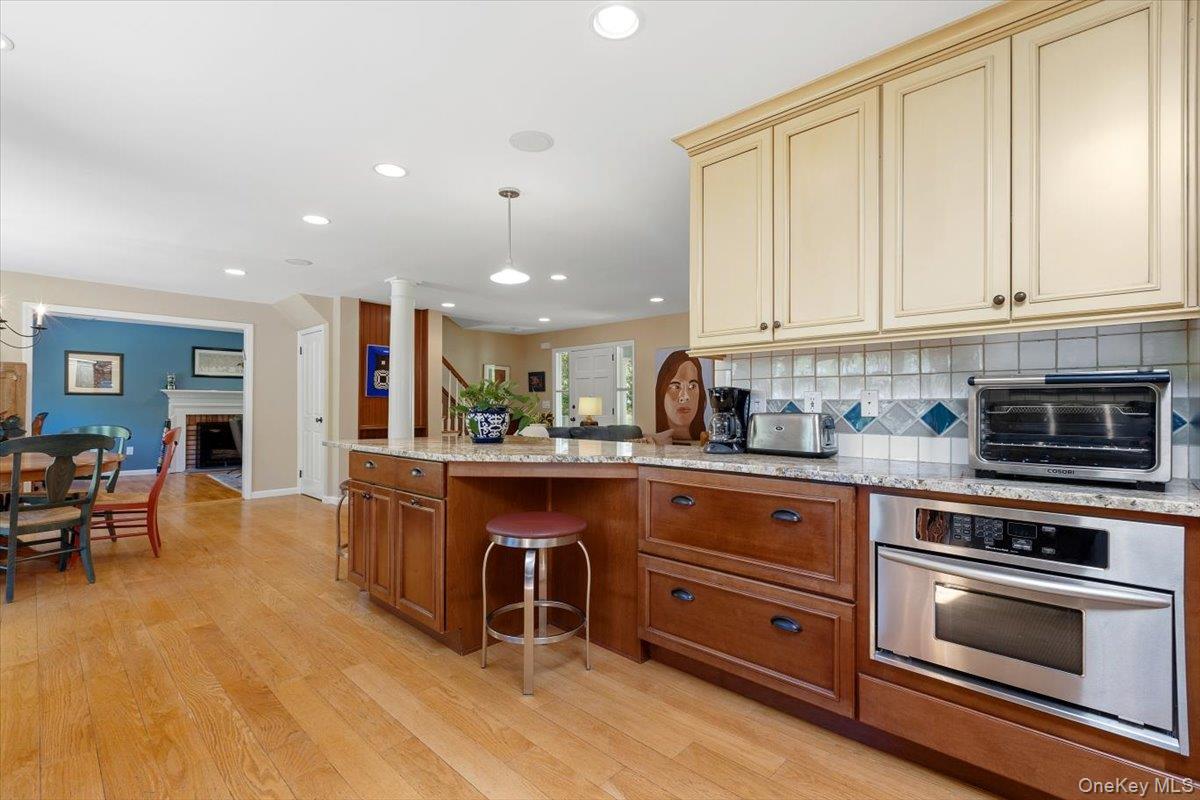 119 Edgewood Road Ossining, NY 10562 - Photo 9 of 50 From this view of the Kitchen, you can see the undercounter convection oven/microwave and custom cabinetry for storage below the counter. You also have a view into the Family Room with FPL, making entertaining a breeze.