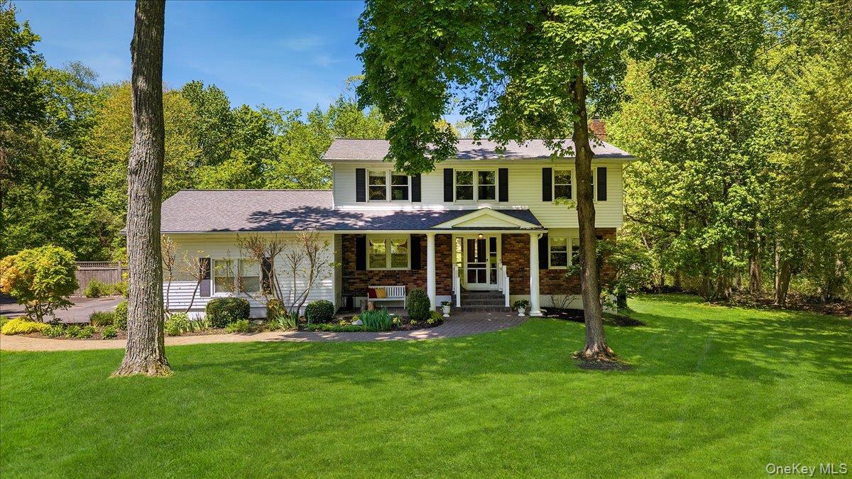 119 Edgewood Road Ossining, NY 10562 - Photo 2 of 50 Let's take a look. Starting with the charming covered front porch, this house feels like home already. Pretty professional landscaping along the paver walkway to the front door.